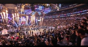 Overwatch League event with large crowd and stage pyrotechnics.