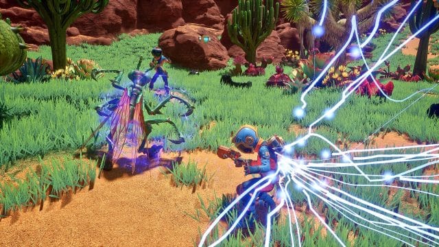 découvrez pourquoi "revenge of the savage planet" va vous fasciner Personnages combattant des insectes géants dans un désert.
