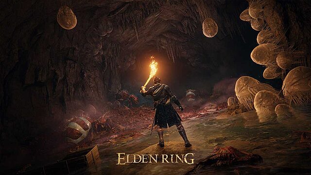 Personnage explore une grotte avec une torche.