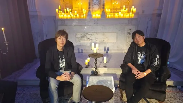 code vein 2: iizuka et yoshimura bousculent les codes – Deux hommes assis près de bougies allumées.