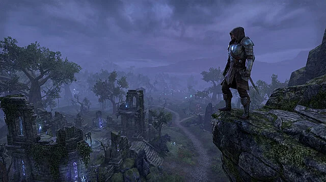 Journey's Edge: Awaiting Adventure in a Ruined Realm A hooded adventurer in dark armor stands on a cliff, overlooking ancient, glowing ruins in a vast, misty blue-purple fantasy landscape.