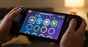Hands hold a handheld gaming console showing a vibrant profile customization screen with diverse, stylized icons and decorative borders.