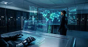 High-tech control room: gloved hands on a glowing holographic keyboard, person views a world network map on a large screen.