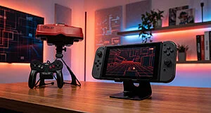 Configuration de jeu avec une console Virtual Boy rouge et son contrôleur. Une Switch affiche un jeu filaire rouge, rappelant l'esthétique VB.