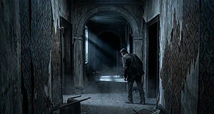 Figure in a derelict mansion corridor peers into a dark, misty archway, illuminated by a dramatic light beam. Peeling walls.