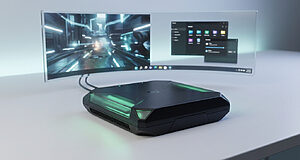 Console/PC hybride noire, style Project Helix, avec éclairage vert, connectée à un écran incurvé transparent montrant jeu et bureau Windows.