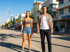 Lucia et Jason : tout savoir sur les personnages de GTA 6 Lucia et Jason debout sur une rue ensoleillée inspirée de Miami, typique de l'univers de GTA 6.