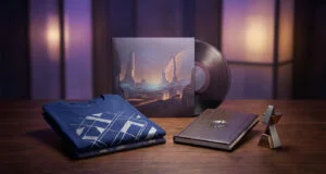 Ensemble de produits dérivés Expedition 33 incluant un disque vinyle, un t-shirt, un livre et une figurine sur une table.