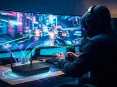 Meilleure box fibre pour le gaming 2026 : quel opérateur choisir ? Gamer portant un casque devant un écran large, avec une box fibre diffusant des faisceaux lumineux de connexion rapide.