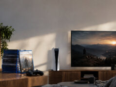 Sony arrête les jeux PS5 sur disque dès janvier 2028 Une console PS5 et une pile de jeux physiques posées sur un meuble TV avec un écran affichant un paysage.