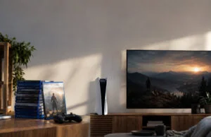 Sony arrête les jeux PS5 sur disque dès janvier 2028 Une console PS5 et une pile de jeux physiques posées sur un meuble TV avec un écran affichant un paysage.