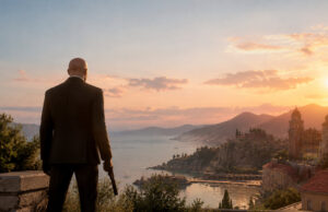 Hitman Absolution remastérisé sur Switch 2 : mise à niveau offerte L'Agent 47 de dos, en costume, contemplant un coucher de soleil sur une ville côtière italienne avec une arme à la main.