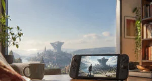 Console portable affichant le jeu Metaphor: ReFantazio sur une table devant une vue panoramique d'une cité fantastique.