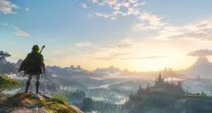 Link contemple un paysage épique et vaste au coucher du soleil, avec un château au loin et une montagne volcanique.